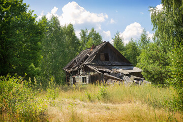 Naklejka na ściany i meble Landscape with an abandoned wooden house, desolation and ruin