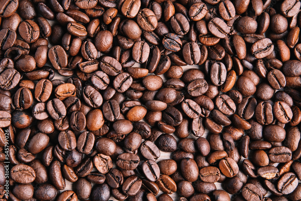 Wall mural closeup of brown roasted coffee beans background