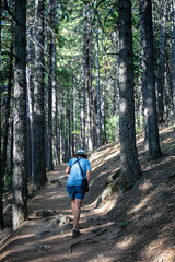 Fototapeta premium Castle Crag California State Park looking at a Beautiful Mature Woman Exploring the Trail