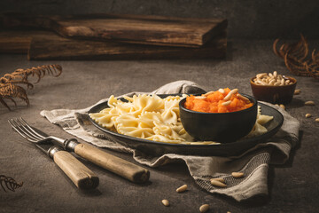 Farfalle pasta with pumpkin puree and pine nuts
