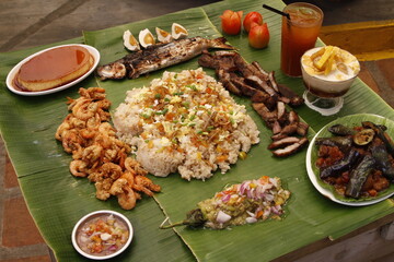 Budol budol fight food: hipon, isda, liempo, talong, leche flan, halo-halo, fried rice - local and traditional Filipino dishes