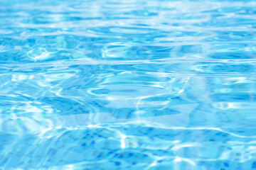 Rippled water in swimming pool as background