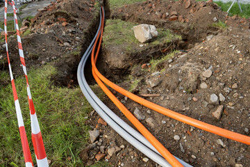underground cable connecting infrastructure installation. Construction site with communication...