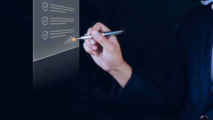 Online business contract Electronic signature,Paperless workplace idea, e-signing, electronic signature, document management,Businessman signs an electronic document on digital document.