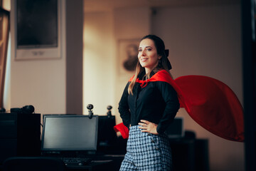 Happy Superhero Businesswoman Wearing a Red Cape in the Office. Super heroine female manager...