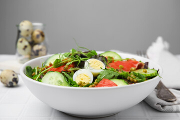 Bowl of salad with mung beans on white tiled table
