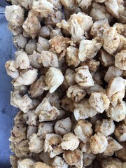 pile of crispy fried tofu at a street food vendor's stall