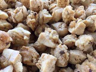 pile of crispy fried tofu at a street food vendor's stall