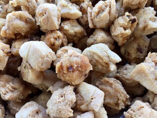 pile of crispy fried tofu at a street food vendor's stall