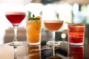 beautiful and delicious alcoholic cocktails prepared at the bar by the bartender.