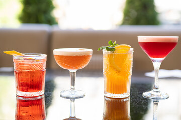 beautiful and delicious alcoholic cocktails prepared at the bar by the bartender.