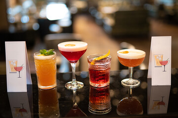 beautiful and delicious alcoholic cocktails prepared at the bar by the bartender.