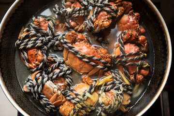 cooking hairy crab or Chinese mitten crab in pot