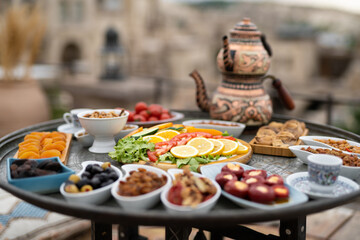 traditional Turkish table with sliced vegetables and fruits.