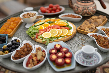 traditional Turkish table with sliced vegetables and fruits.