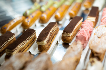 various delicious sweet pastries in the shop window.