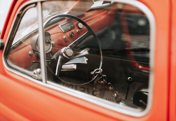 Naklejka premium retro car with a beautiful design, the steering wheel is closed with an old lock on a chain.