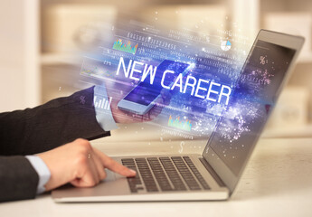 Closeup of businessman hands working on laptop