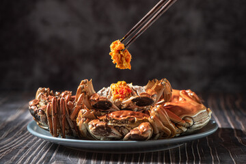 Fresh and delicious hairy crab or chinese mitten crab with crab roe on table © zhikun sun