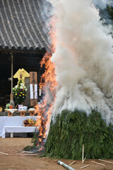 lighting a holy fire at Yakushi-ji temple