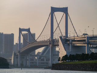 Sunny view of the Rainbow Bridge and cityscape