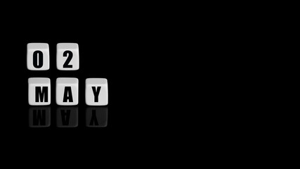 May 2th. Day 2 of month, Calendar date. White cubes with text on black background with reflection.Spring month, day of year concept