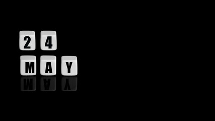 May 24th. Day 24 of month, Calendar date. White cubes with text on black background with reflection.Spring month, day of year concept