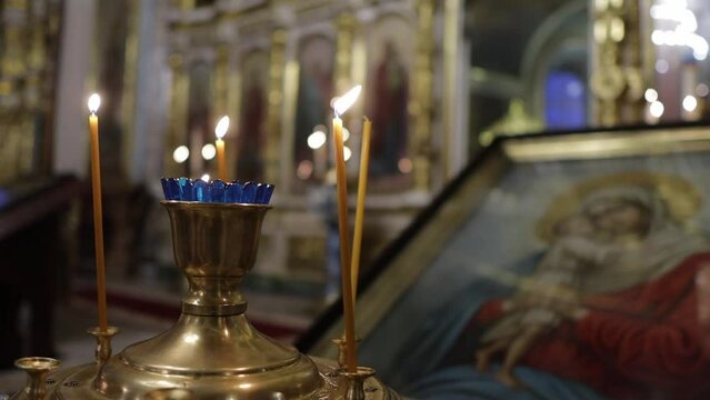 candles in an Orthodox church in front of an icon