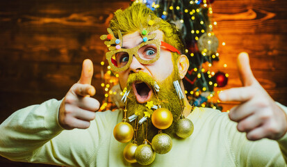 Funny Santa point on you. Portrait of a excited Santa Claus. Hipster Santa. Holly jolly swag Christmas and noel.