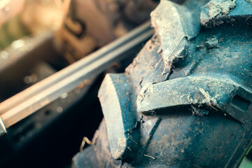 Volumetric rubber tread on a tractor wheel close-up. Mud tread pattern for greater flotation on agricultural machinery