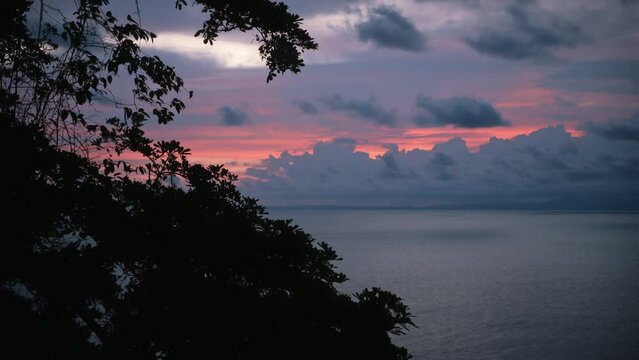 Dark trees and the ocean after sunset in Costa Rica