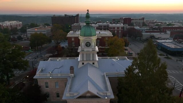 Historic City Hall in Athens Georgia, home of University of Georgia. Rising aerial at sunrise.