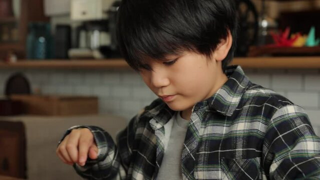 Japanese boy playing Shogi, Japanese board game, seriously.