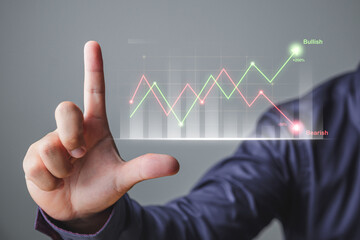 Investing concept. The man uses hand to open chart. That is comparison of stock markets in bullish and bearish. Hologram future technology.