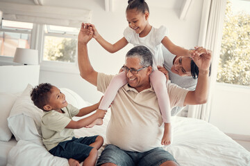 Family, grandfather and piggy back on bed, having fun and bonding. Support, love and care of...