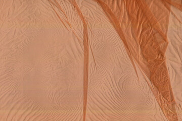 orange plastic sheet material surface