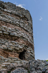 Closeup of hole in side of ancient castle tower ruins.