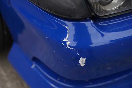 Damaged  car's front bum[er
