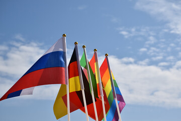 Rainbow flag and National flags of East Asia countries, soft and selective focus, concept for LGBT celebration and respecting gender diversity of human in Muslim or Islam countries around the world.