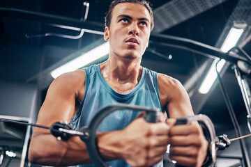 Fitness, exercise and man focus in gym to build muscles, sport strength and training healthy muscle...