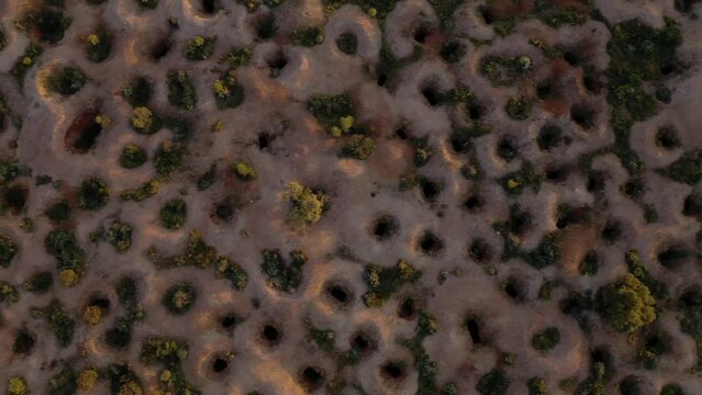 Sunrise over abandoned opal mines in desert landscape drone