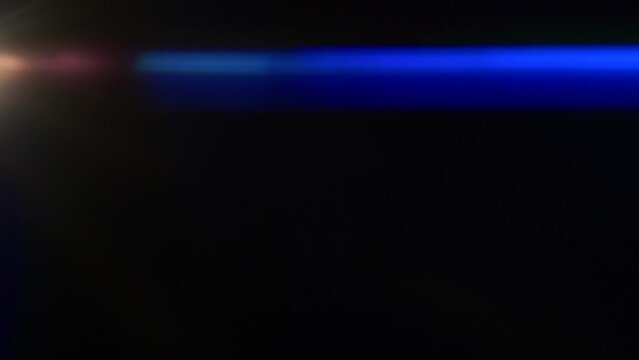 Anamorphic lens flare, bokeh light leaks, flash ray effect over black background