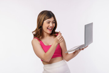 Fototapeta premium Portrait of young woman taking a photo with laptop computer isolated over white background