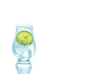 A Glass of gin and tonic with ice and fresh lime slice isolate on white background. Fun and Party drink concept.