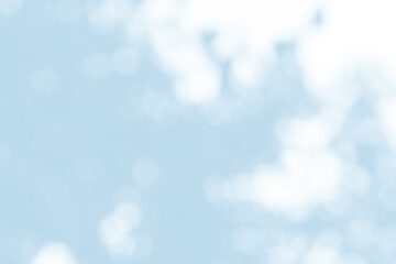 Abstract light blue blur bokeh for background, light blur on high light blue gradient abstract background in central design for presentation.