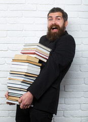 Funny teacher or professor with book stack. Thinking serious mature teacher. Mature professor, middle aged teacher, bearded fun man. Study concept. Teachers day.