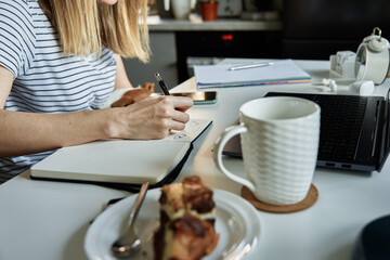 Freelancer working from home. Creative designer drawing illustration at notebook. Remote working workplace with laptop on the table