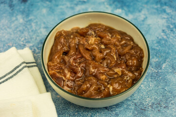 Raw pork meat slice with marinated sauce in bowl ready to cooking