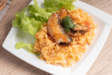 Fried rice with canned fish in a white plate.Thai food