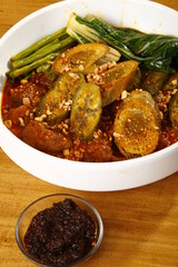 Kare-kare, a filipino dish of ox tripe, assorted vegetables and peanut sauce